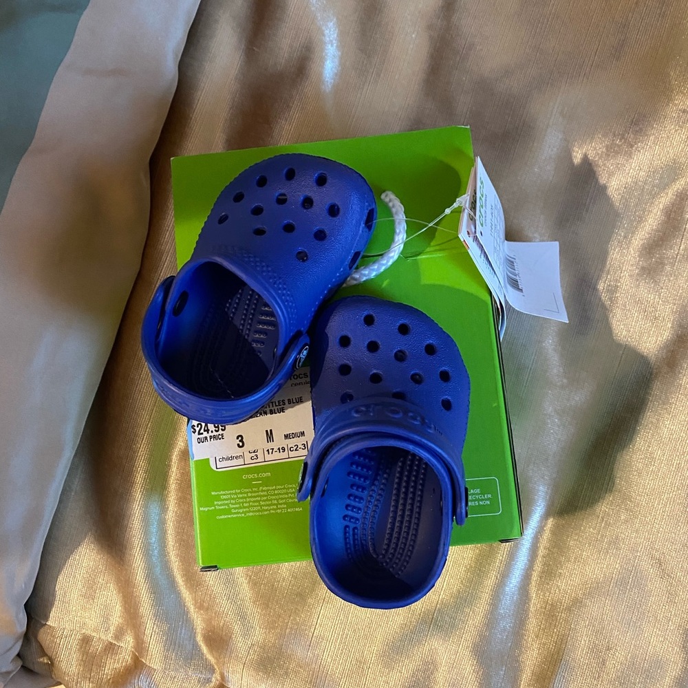 Cute new in box child crocs size 3. In a gift box. So cute for Christmas gift